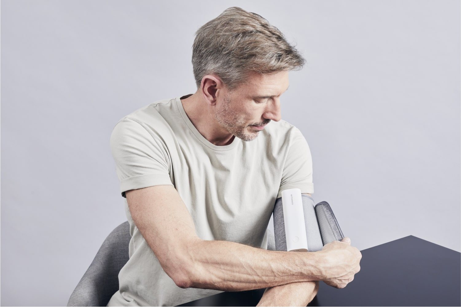 Withings BPM Connect blood pressure monitor worn on an upper arm